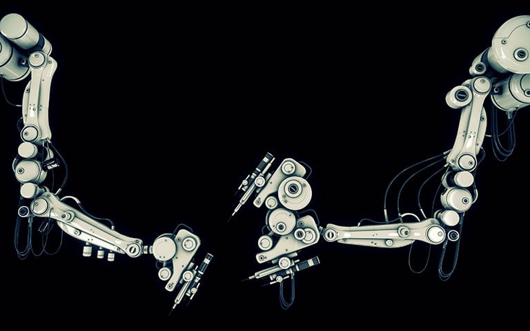 Two robotic arms on a black background